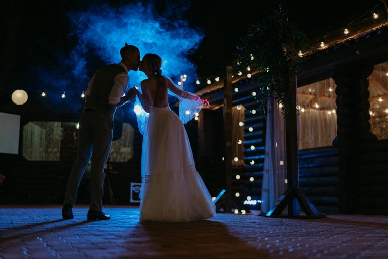 Bride and Groom Kissing at Night 